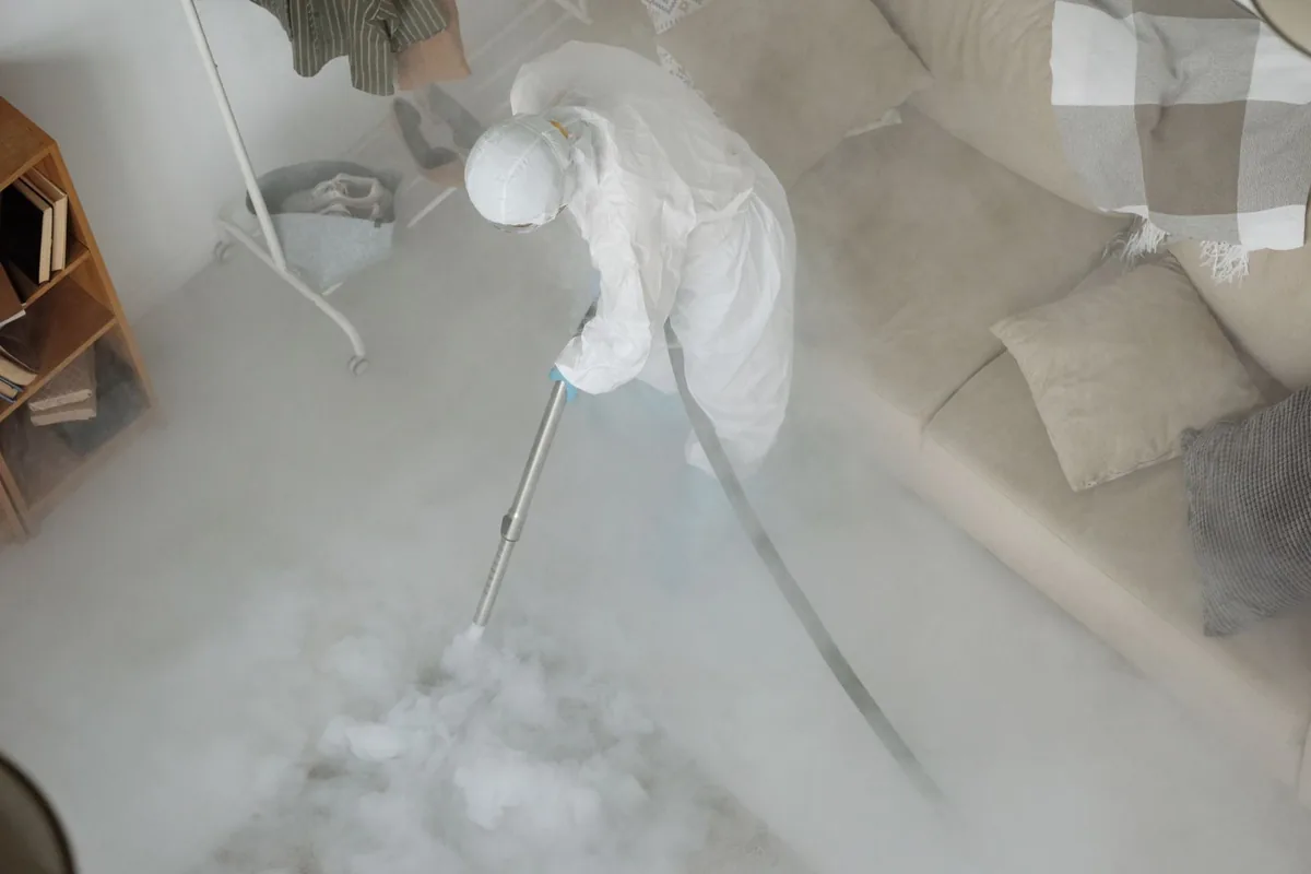 Biohazard cleanup technician in protective equipment, Osage, IA